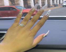 Ariana has a huge interest in nail art and tries different styles of beautiful nail design.